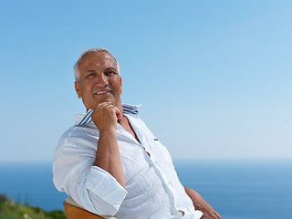 Image showing senior man sitting outside
