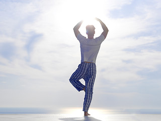 Image showing young man practicing yoga