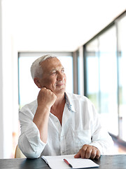 Image showing Portrait of senior man relaxing in sofa