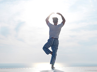 Image showing young man practicing yoga