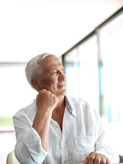 Image showing Portrait of senior man relaxing in sofa