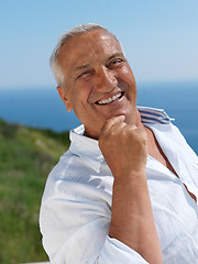 Image showing senior man sitting outside