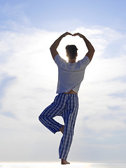 Image showing young man practicing yoga