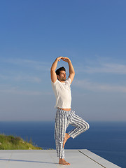 Image showing young man practicing yoga