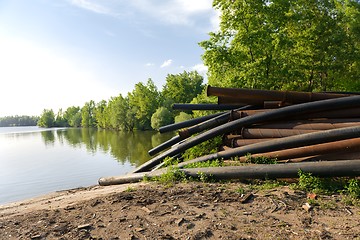 Image showing Rusty metal pipes in the forest