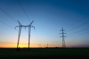 Image showing Large transmission towers at blue hour 