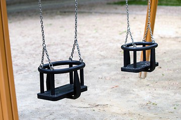 Image showing Empty playground swings