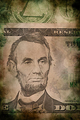 Image showing Macro of Abraham Lincoln on five USA dollar banknote grunge vintage style