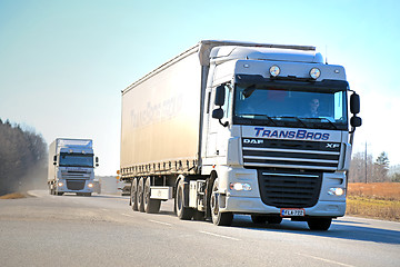 Image showing Two White DAF XF Semi Trucks on the Road