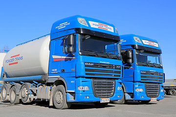 Image showing Two Blue DAF XF 105 Trucks