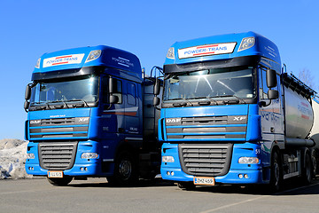 Image showing Two Blue DAF XF 105 Trucks