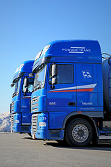 Image showing Two Blue DAF XF 105 Trucks