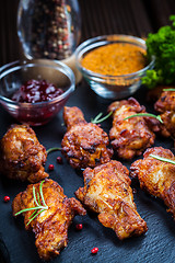 Image showing BBQ chicken wings with spices and dip