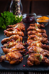 Image showing BBQ chicken wings with spices and dip