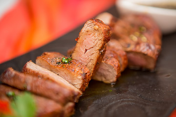 Image showing organic fresh ripe roasted beef meat with sauce