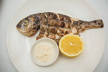 Image showing Grilled fish with lemon 