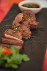 Image showing organic fresh ripe roasted beef meat with sauce