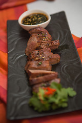 Image showing organic fresh ripe roasted beef meat with sauce