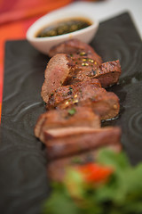 Image showing organic fresh ripe roasted beef meat with sauce