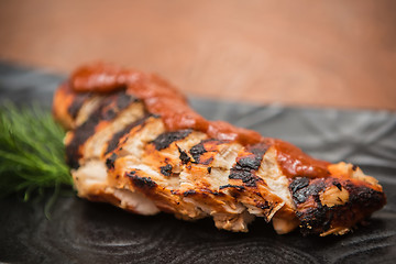 Image showing the cut chicken fillet baked in spices and tomato sauce