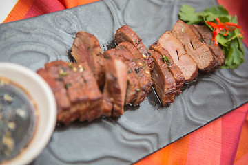 Image showing organic fresh ripe roasted beef meat with sauce