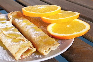 Image showing pancakes with oranges