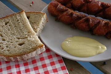 Image showing delicious sausages with bread