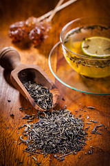 Image showing Dry tea on wooden table