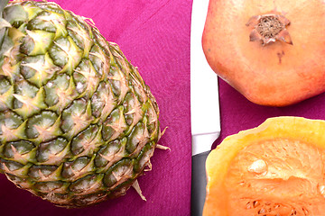 Image showing fresh pineapple with pumpkin and knife