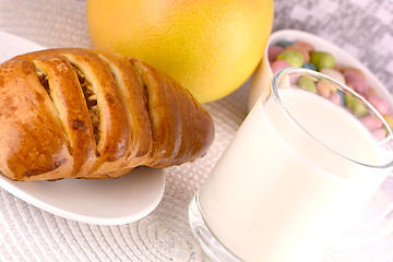 Image showing sweet cake on white plate and fruits with milk