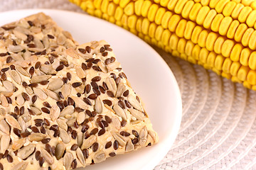 Image showing sweet cake on white plate and corn
