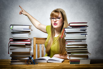 Image showing Female teacher pointing back