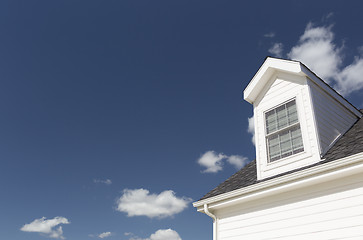 Image showing Roof of House and Windows Against Deep Blue Sky