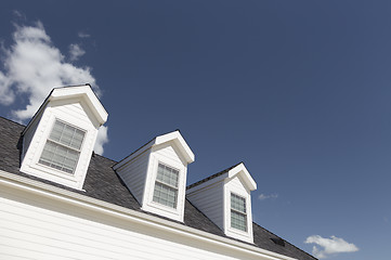 Image showing Roof of House and Windows Against Deep Blue Sky