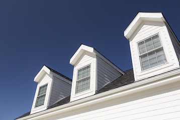 Image showing Roof of House and Windows Against Deep Blue Sky