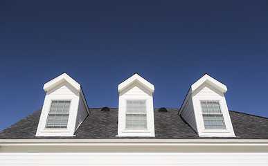 Image showing Roof of House and Windows Against Deep Blue Sky