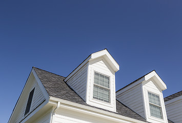 Image showing Roof of House and Windows Against Deep Blue Sky