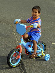 Image showing Riding a bike