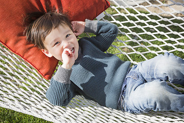 Image showing Cute Mixed Race Boy Relaxing in Hammock