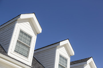 Image showing Roof of House and Windows Against Deep Blue Sky