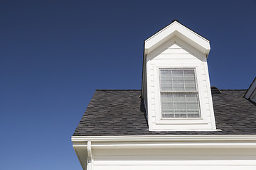 Image showing Roof of House and Windows Against Deep Blue Sky