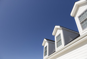 Image showing Roof of House and Windows Against Deep Blue Sky