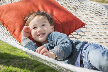 Image showing Cute Mixed Race Boy Relaxing in Hammock