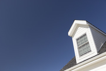 Image showing Roof of House and Windows Against Deep Blue Sky