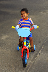 Image showing Riding a bike
