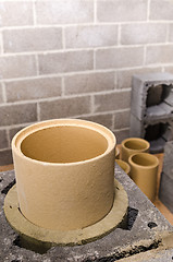 Image showing Construction of modular ceramic chimney in the house