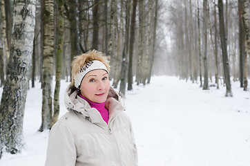 Image showing Portrait of a middle-aged woman on the background of a winter al