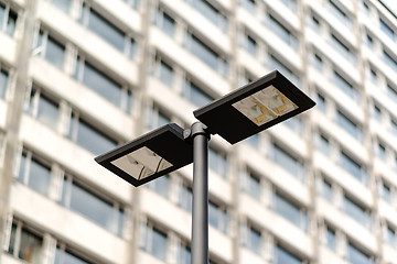 Image showing Modern streetlamp and concrete building