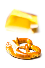 Image showing Fresh German pretzel  out of its paper bag on white 