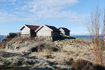 Image showing three old boat house